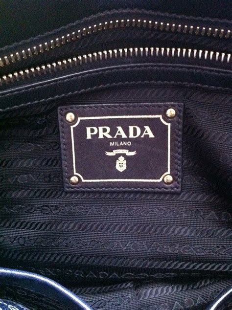 how to tell if a prada purse is real|prada authentic handbags guide.